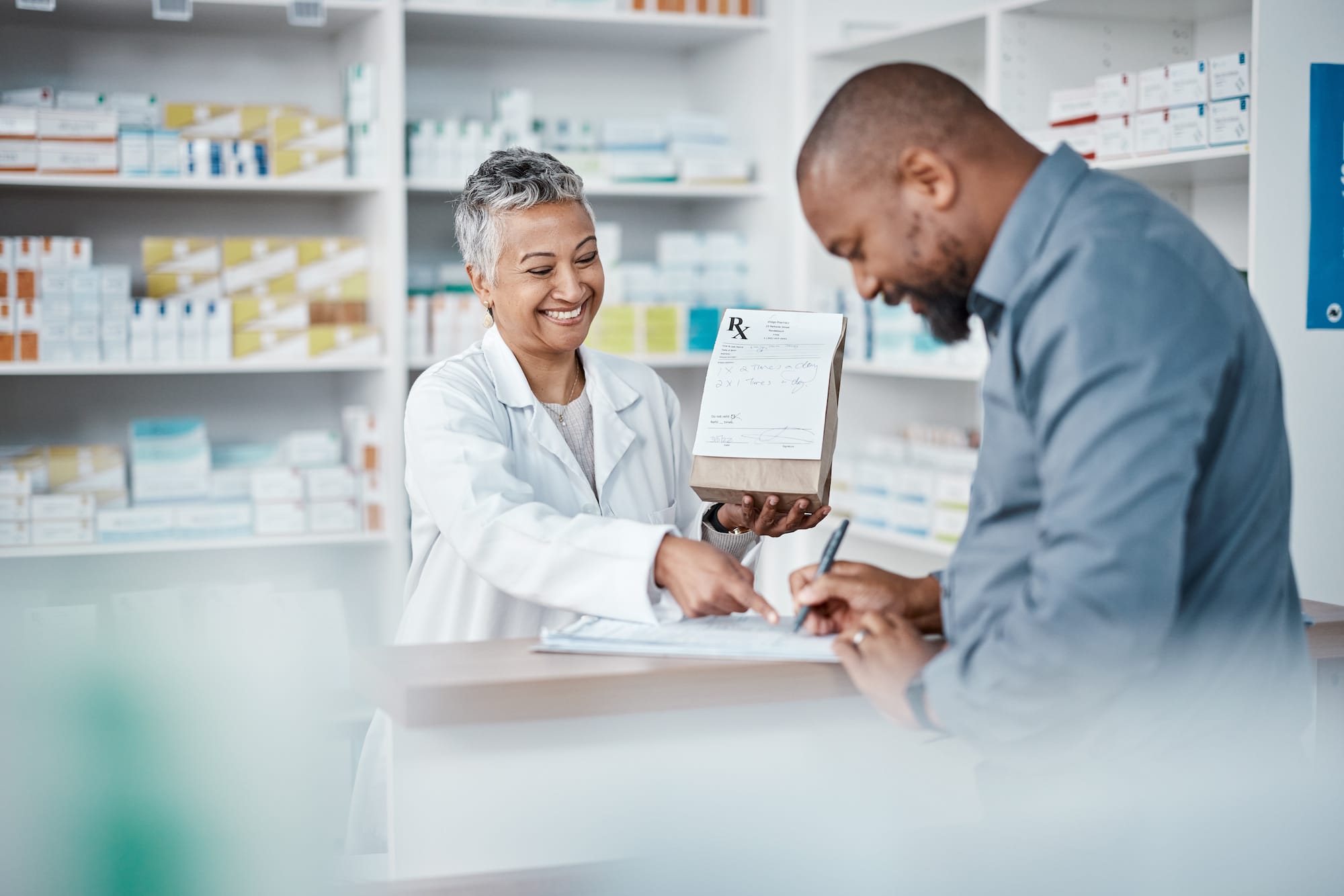 Female Pharmacist helping a patient.